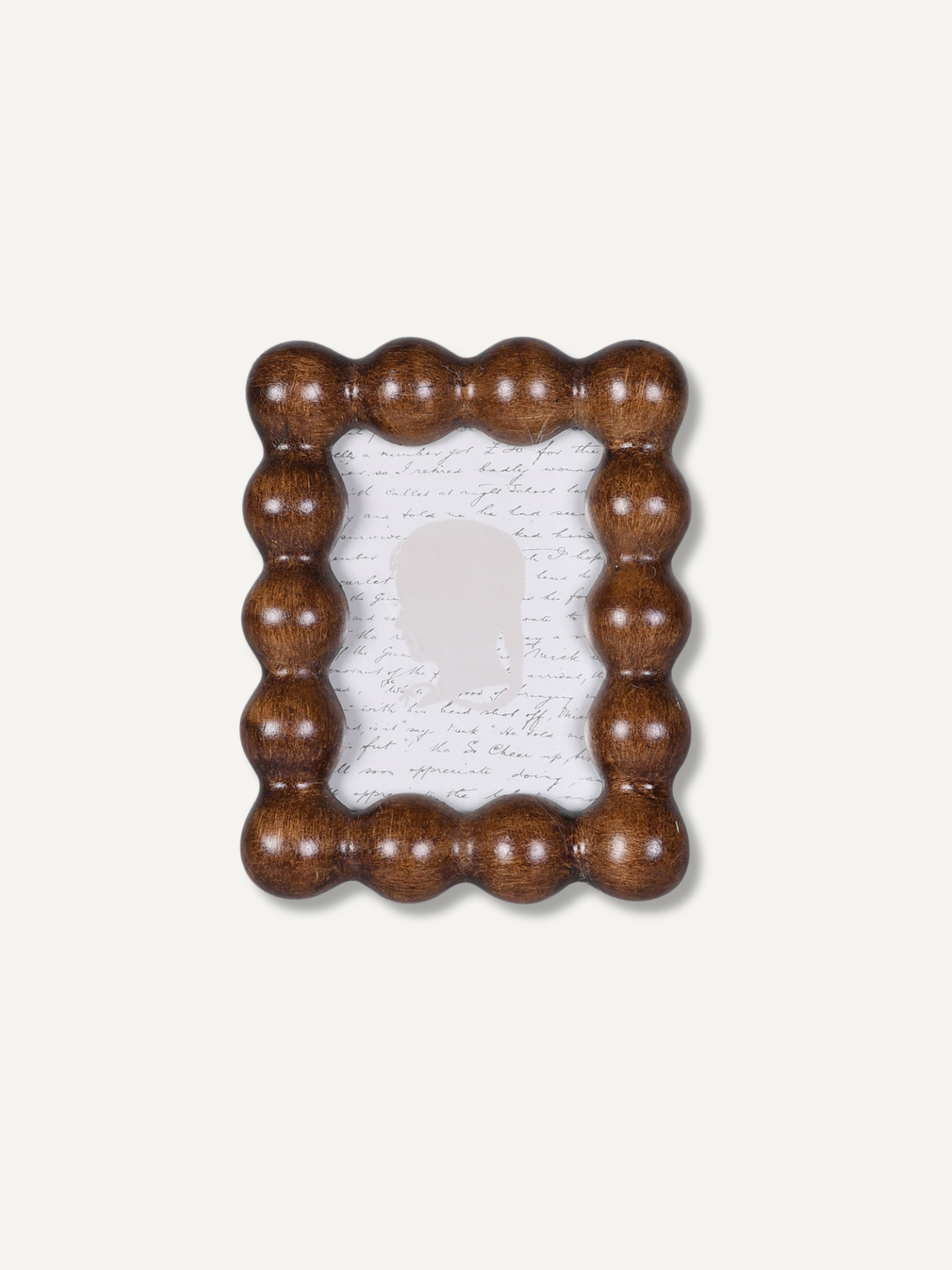 A rectangular polyresin picture frame with a decorative bobble beaded border, shown on a light off-white background.