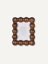 A rectangular polyresin picture frame with a decorative bobble beaded border, shown on a light off-white background.