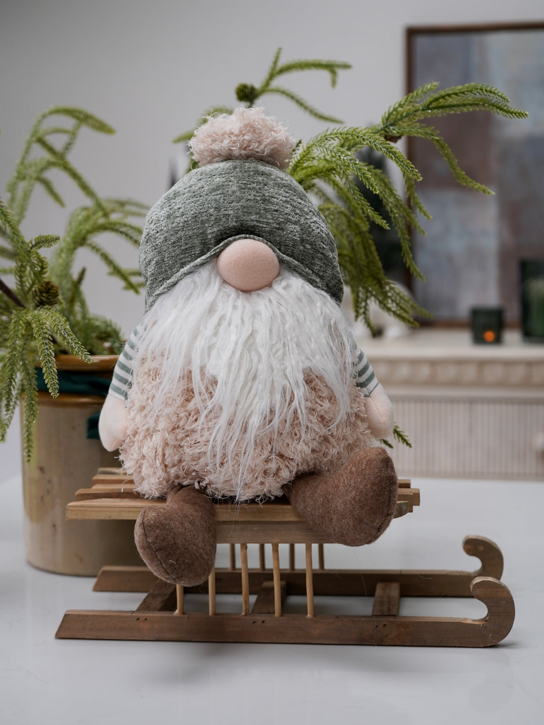 Gnome gonk on a sled with plants in the background