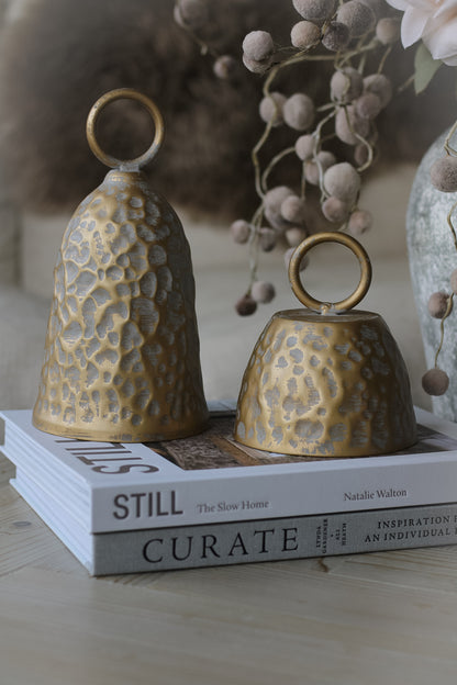 rustic christmas bells styled on a pair of coffee table books