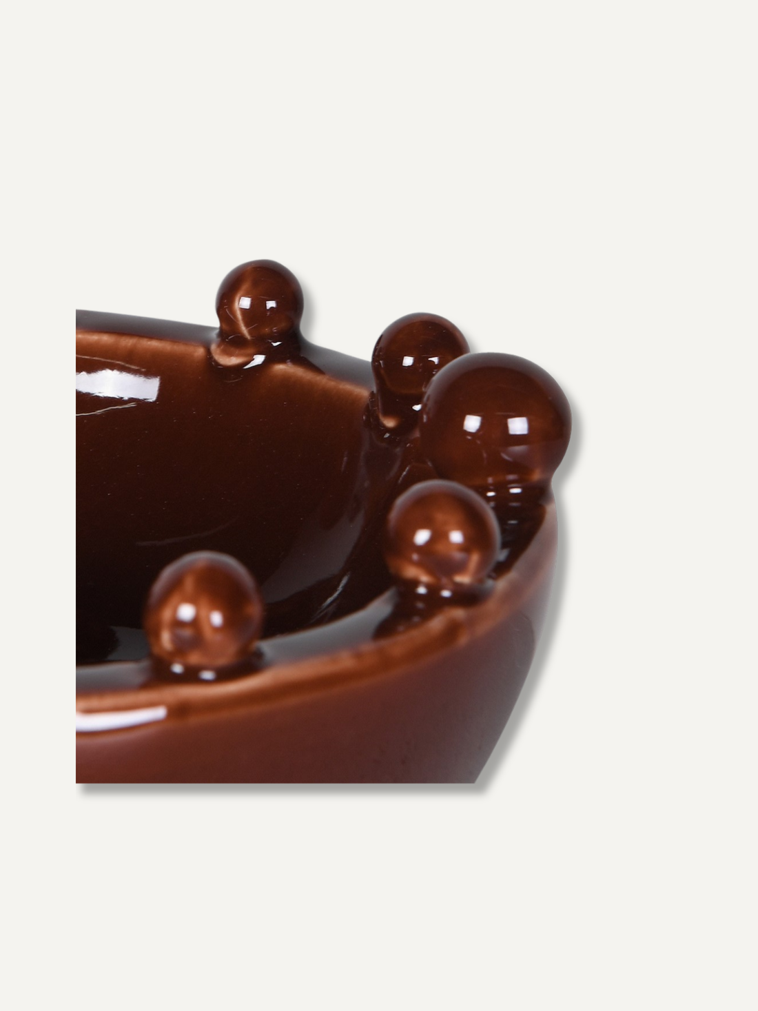 Brown glazed toned decorative bowl with small bobble design around the rim