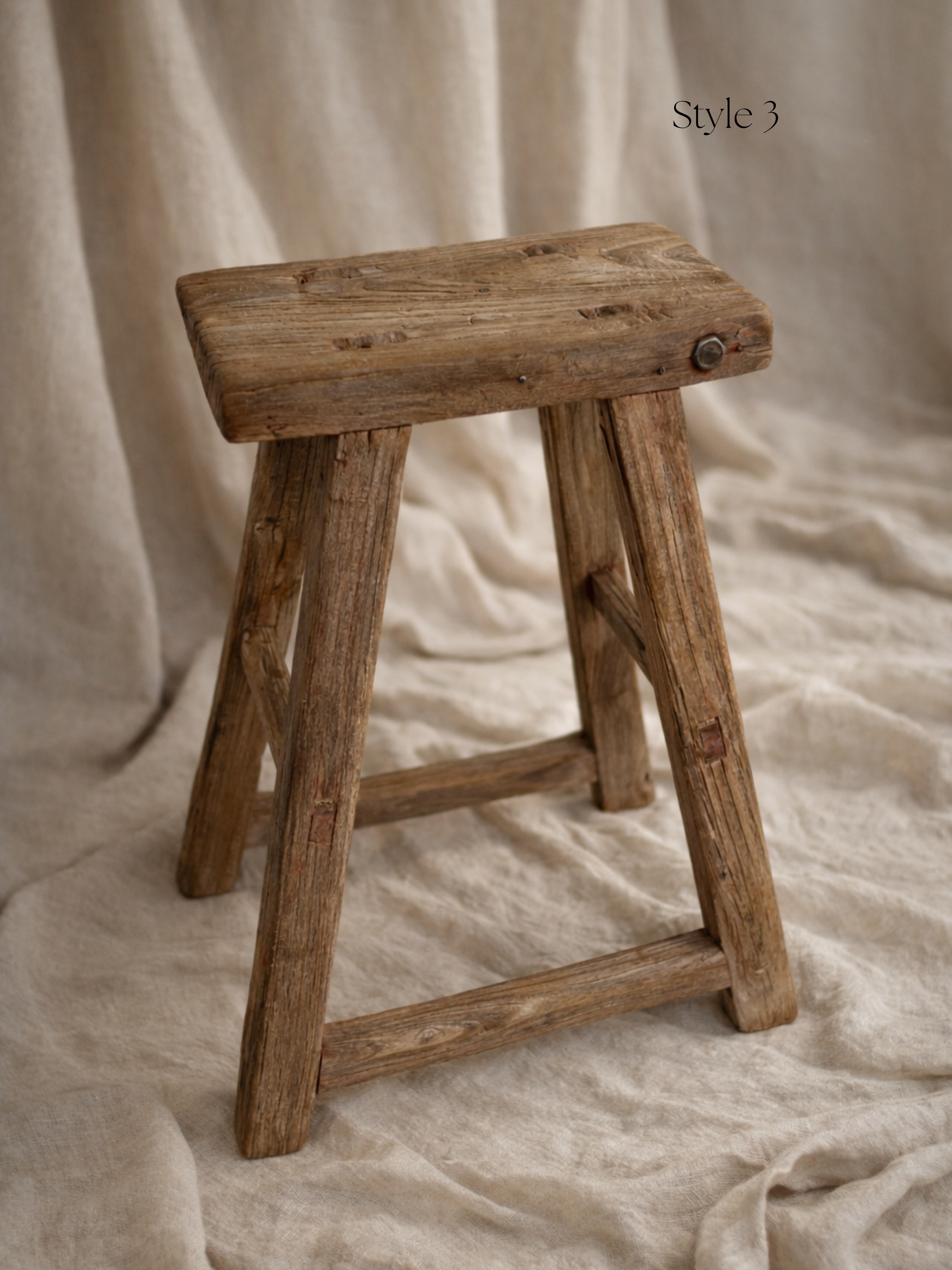 Wooden stool on a textured beige background for home decor