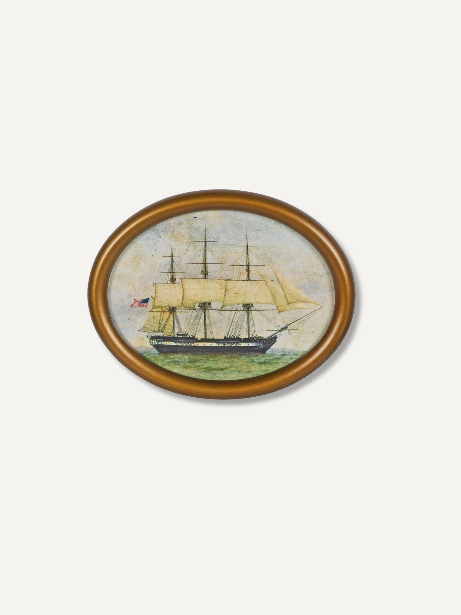 An oval framed painting depicting a historic three-masted sailing ship on green water under a pale sky, set against a light gray background.